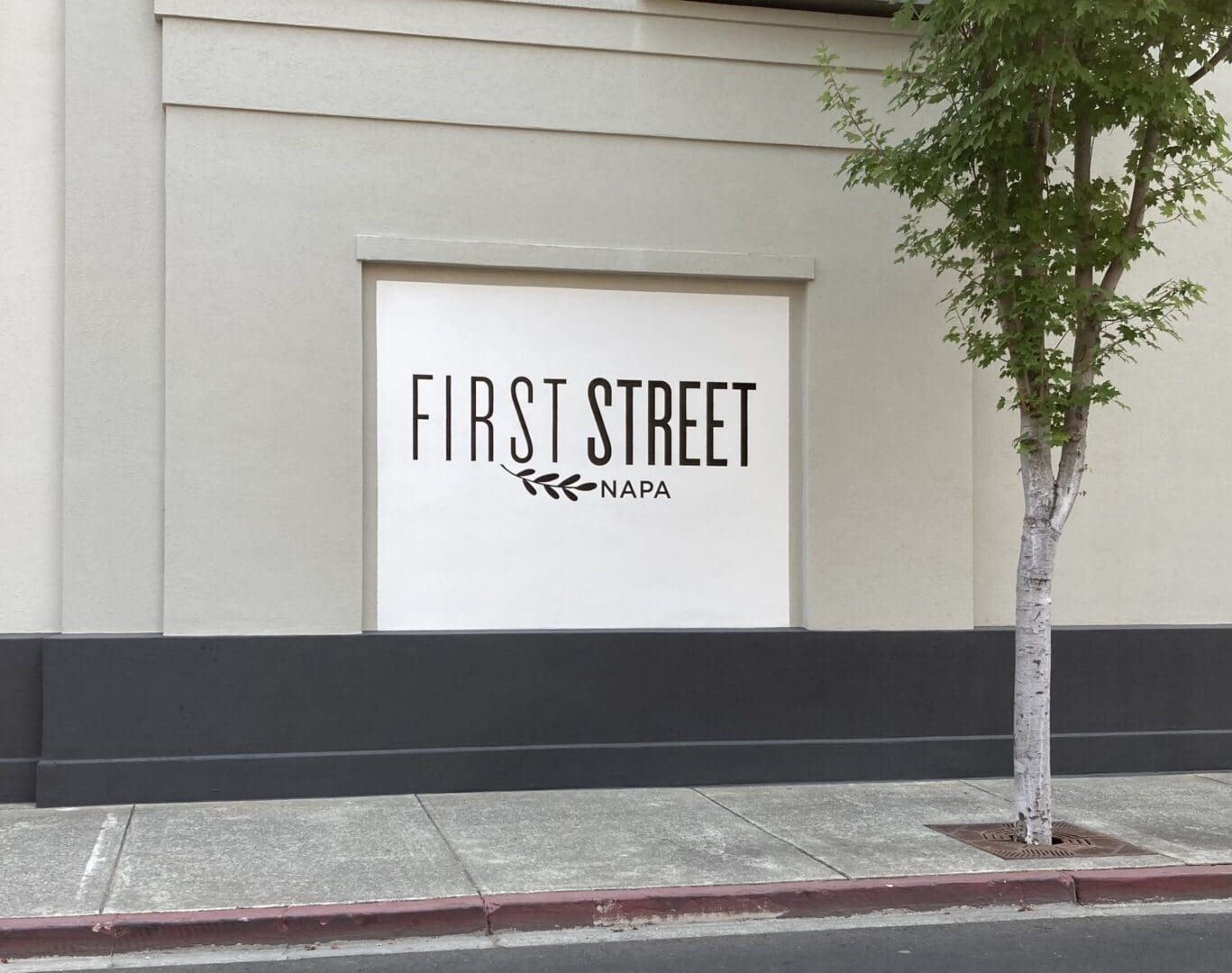 First Street Napa sign on building exterior.