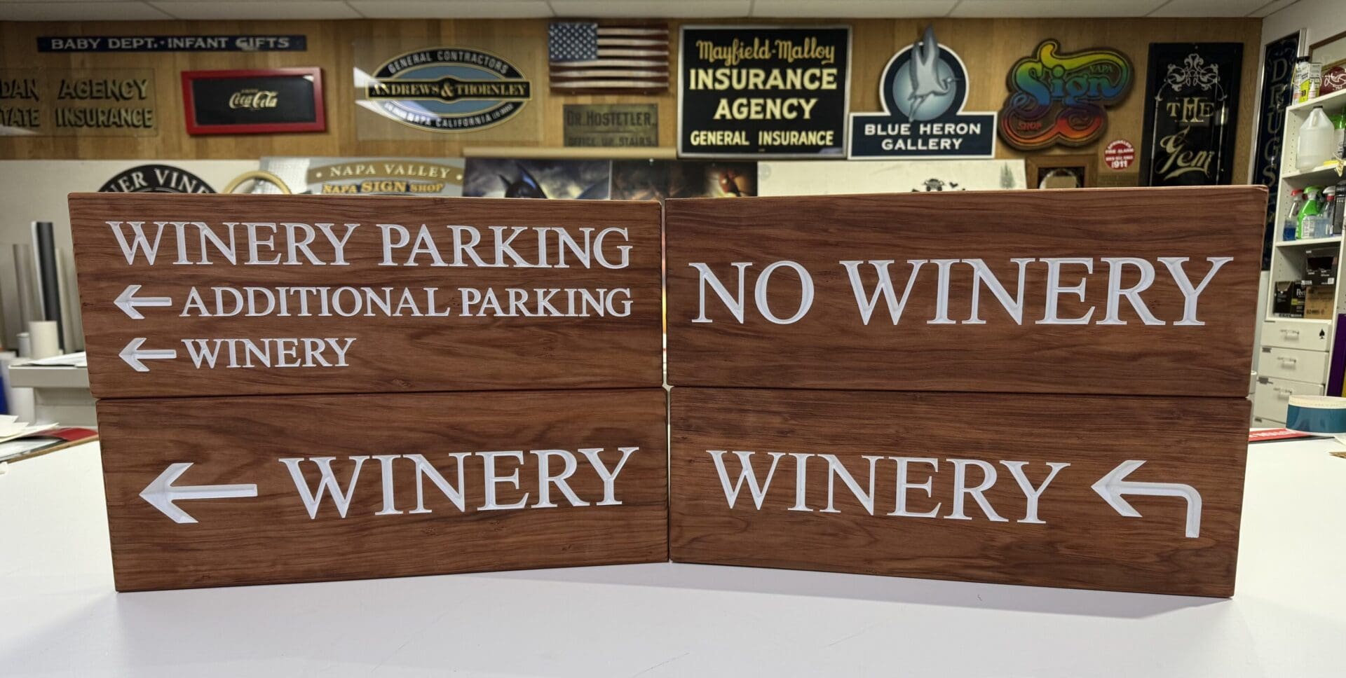 Wooden signs with winery directions and arrows.