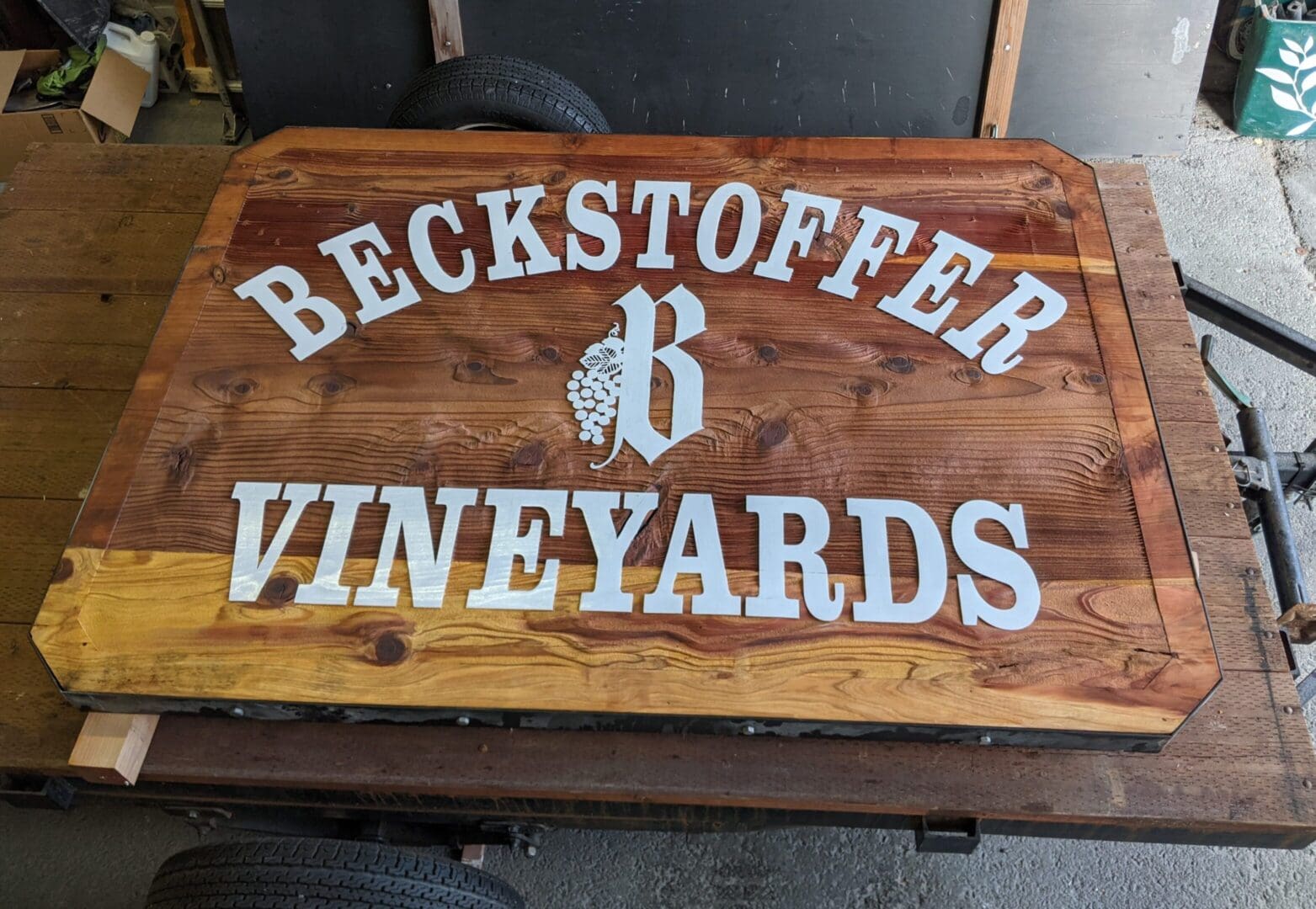 Wooden sign reading "Beckstoffer Vineyards" with grapes.