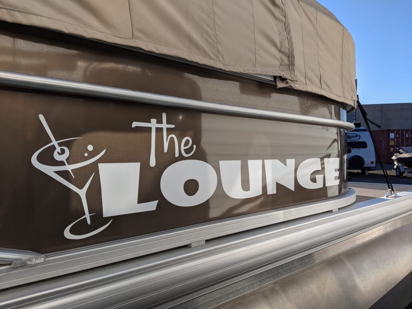 Boat with "The Lounge" written on side.